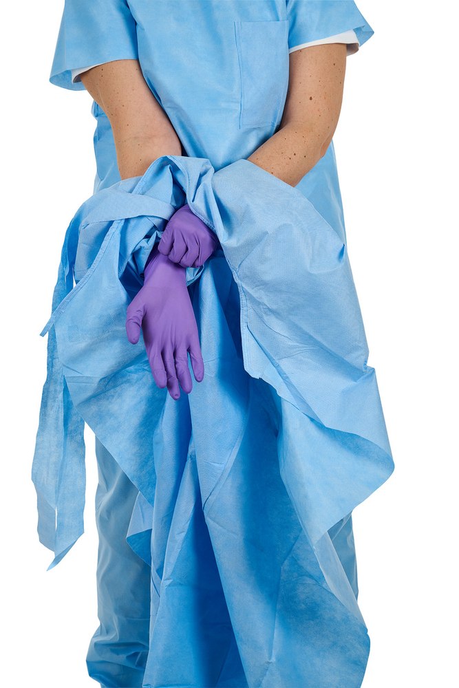 Remove gloves with the gown